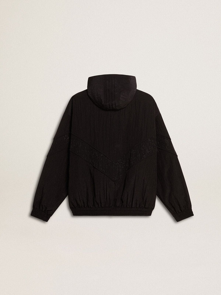 dameswindjack van zwart nylon met kristallen in dezelfde kleur.