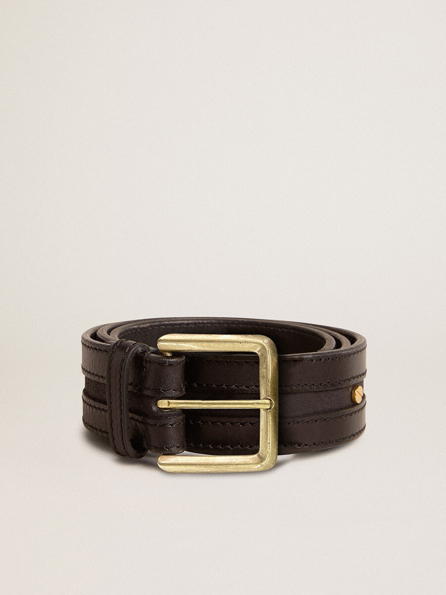 damesriem in zwart gewassen leer met gouden studs.