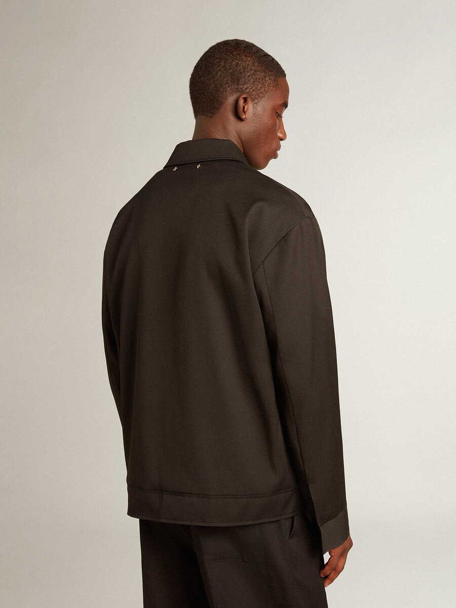 herenjas met ritssluiting van zwarte wollen gabardine.