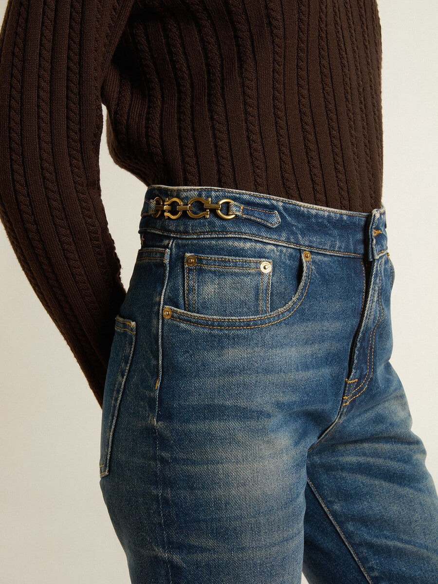 damesjeans met bootcut model vintage wassing en metallic details.