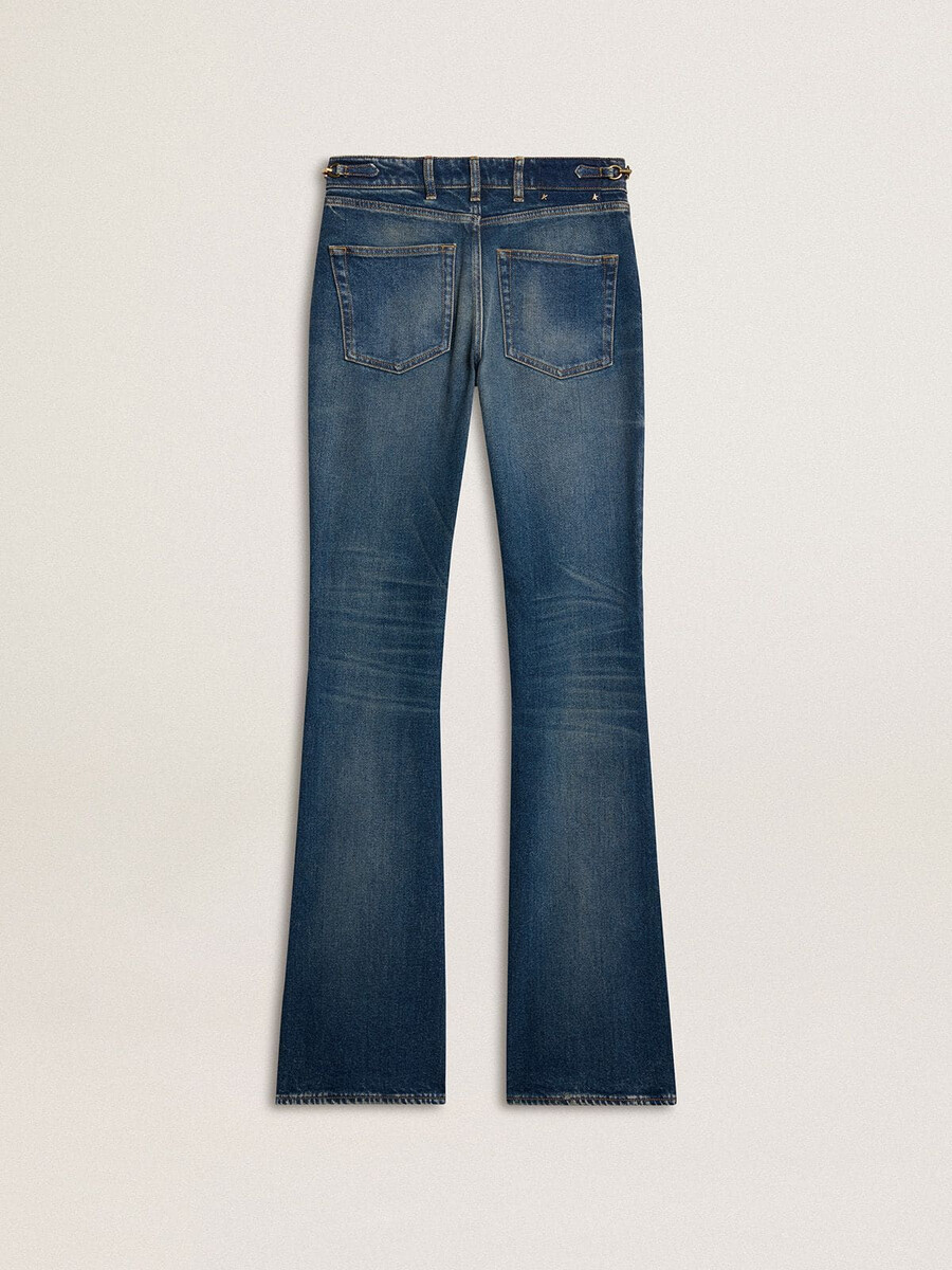 damesjeans met bootcut model vintage wassing en metallic details.