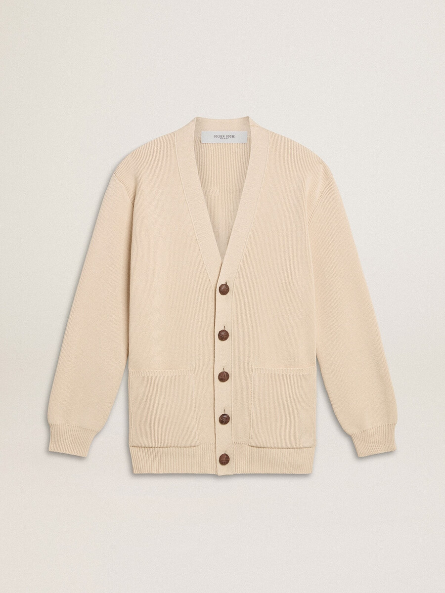beige damesvest met golden-letters op de achterkant.