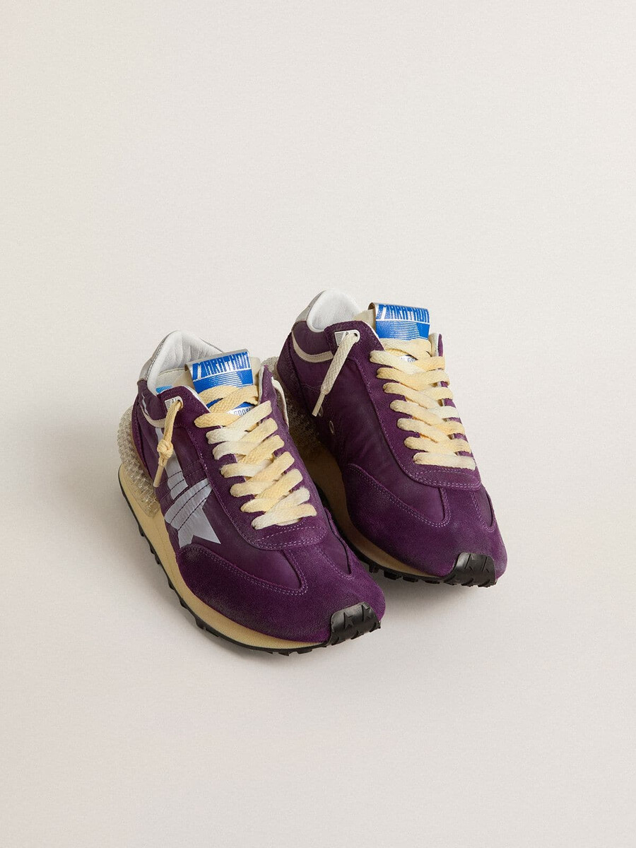 damesmarathon met paars nylon bovenwerk en witte ster