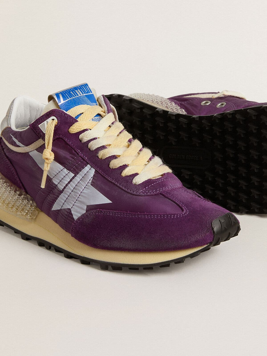 damesmarathon met paars nylon bovenwerk en witte ster