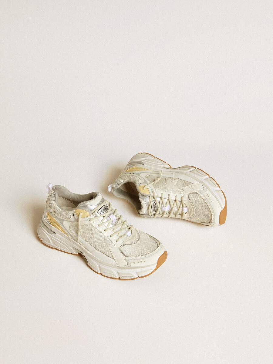 dames lightstar in wit leer en mesh met een versleten witte ster.