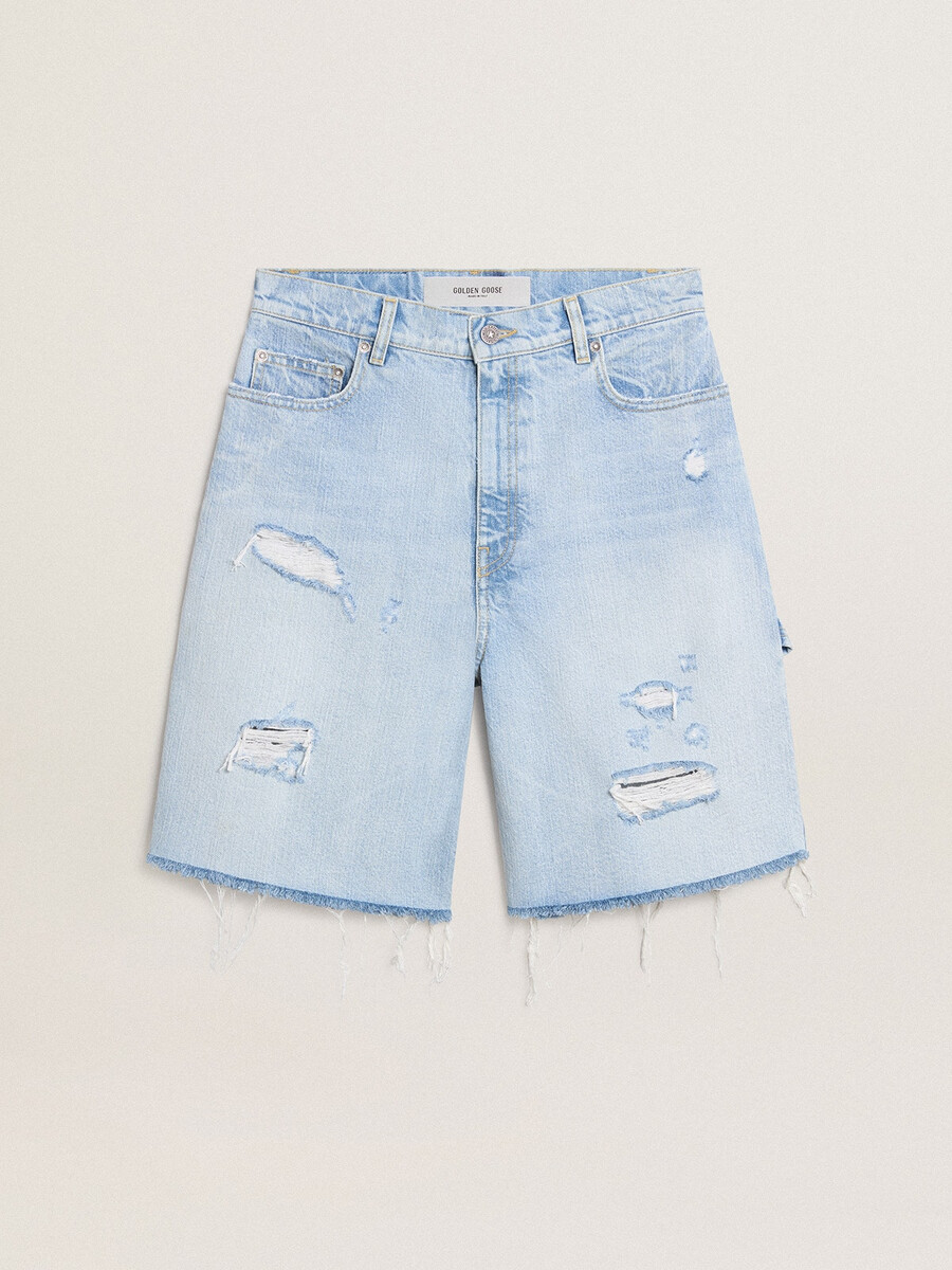 damesbermudashorts van denim met een gedragen look.