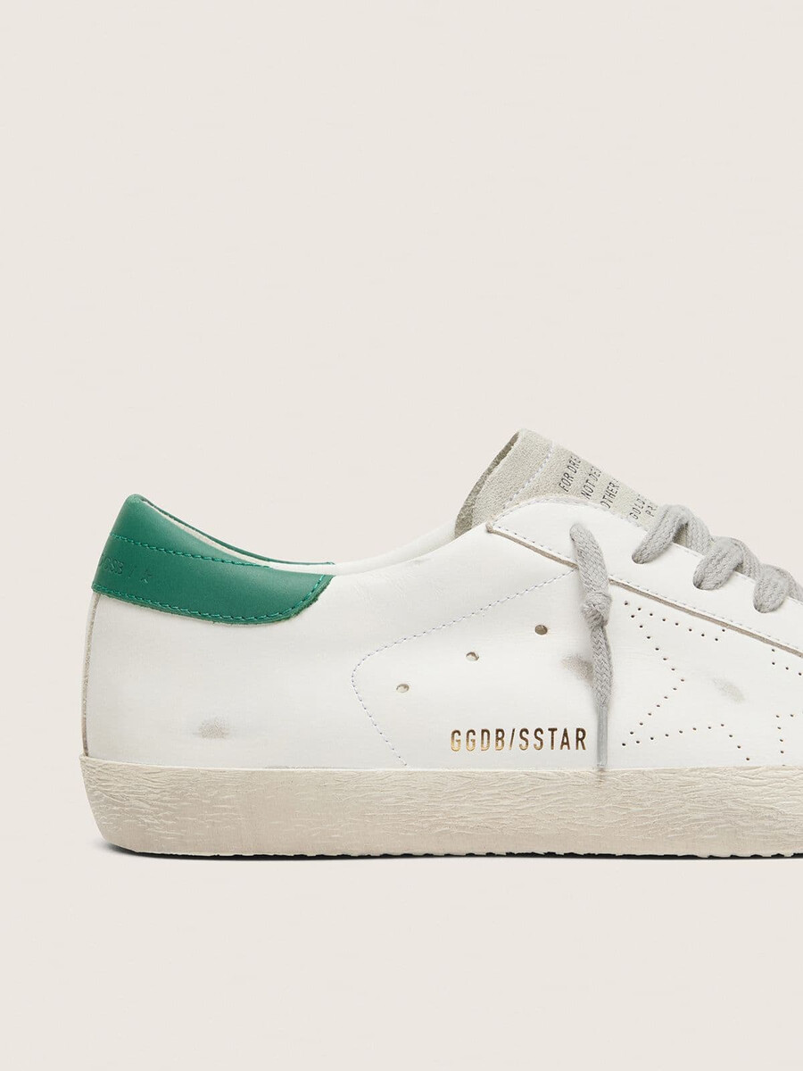 heren super-star met geperforeerde ster en groene hielband.