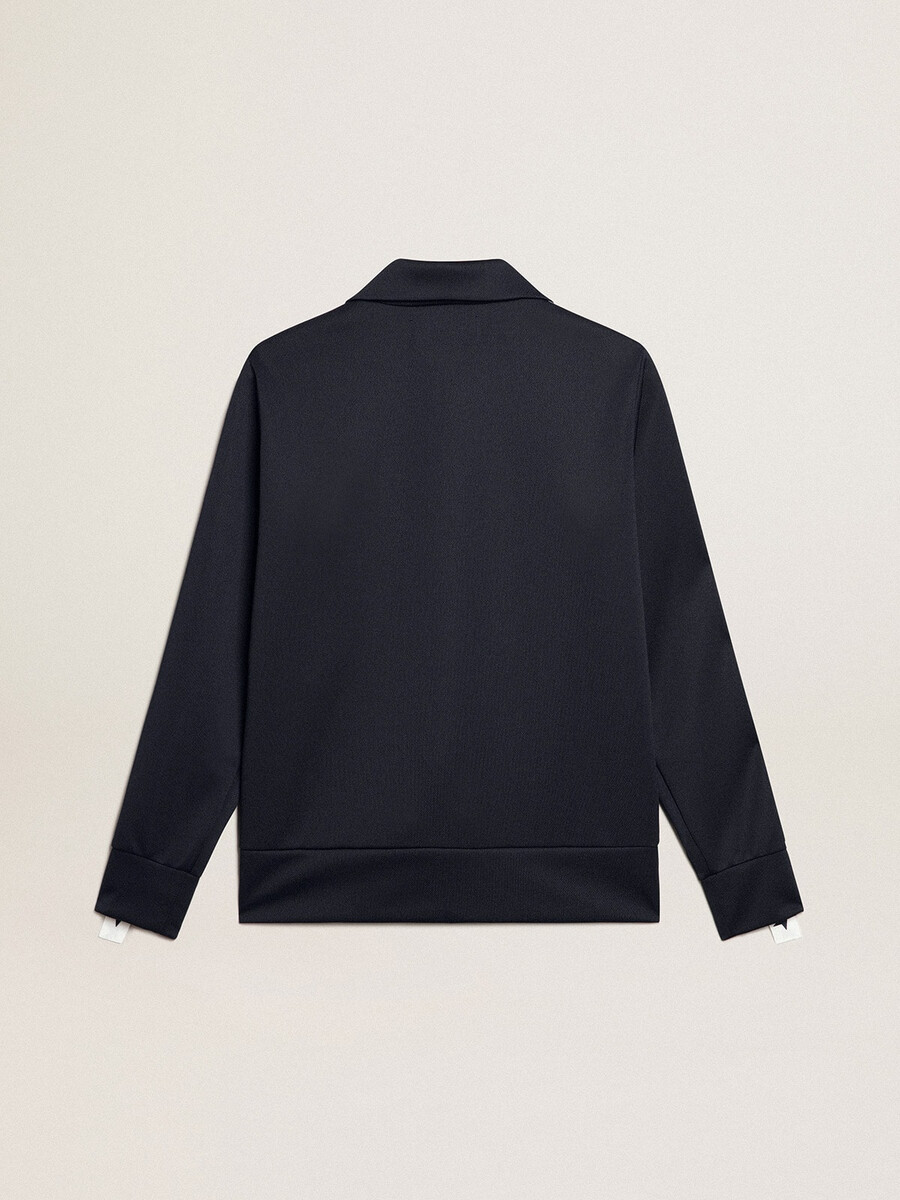 donkerblauwe sweater met rits witte streep en contrasterende sterren.