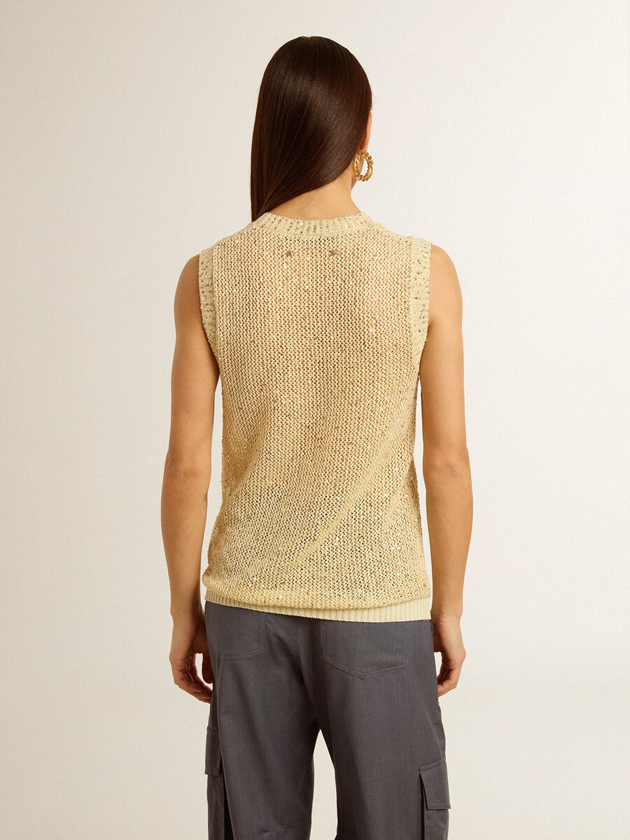 top van mesh-breisel met pailletten en contrasterende details.