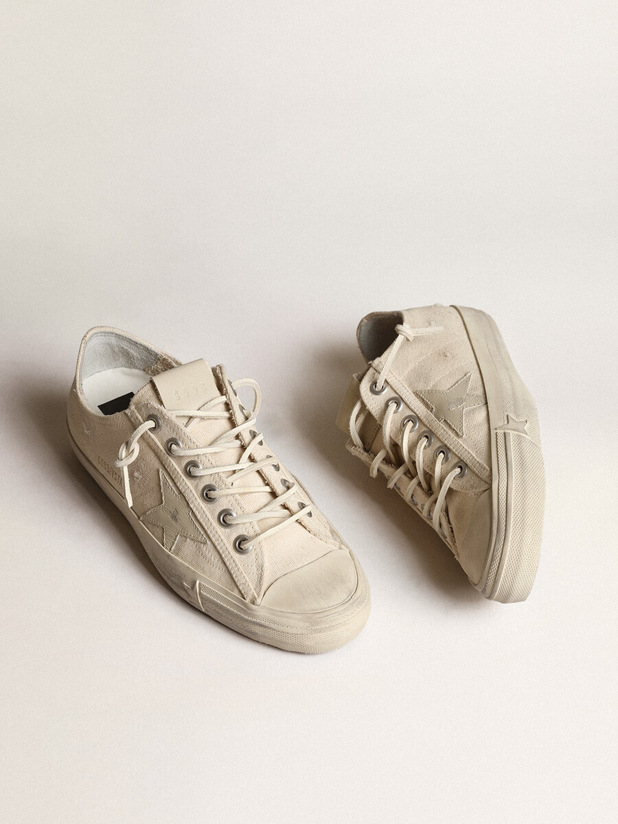 v-star in lichtcrème canvas met melkwitte leren ster