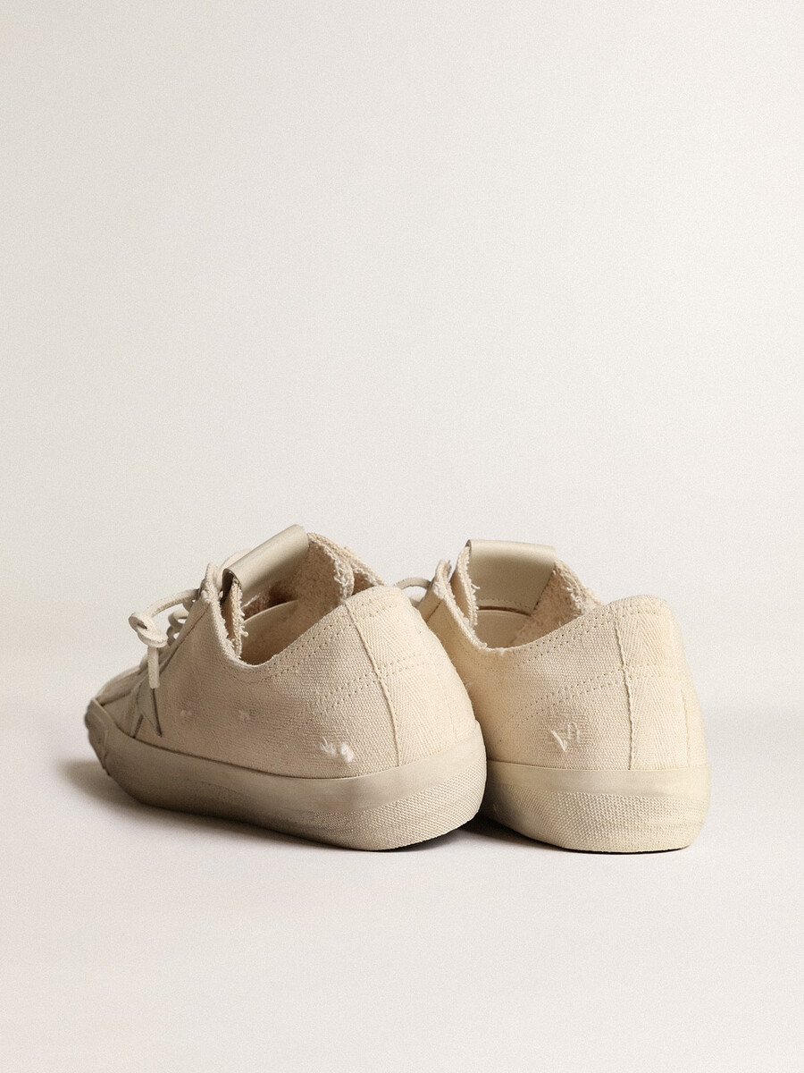 v-star in lichtcrème canvas met melkwitte leren ster